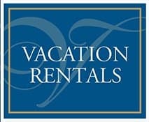 A blue sign with the text "VACATION RENTALS" in white lettering.